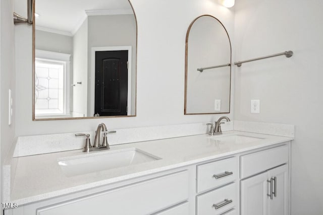 bathroom with vanity and ornamental molding