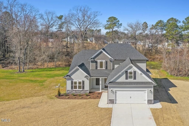 view of front of house with a garage and a front yard