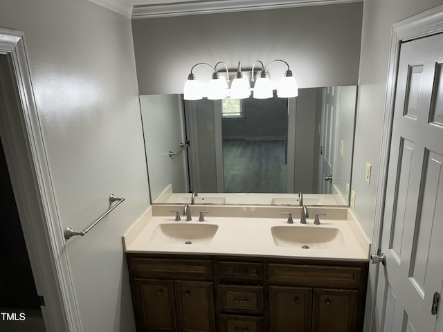 bathroom with vanity and ornamental molding