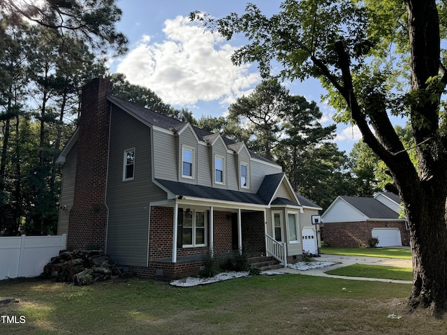 view of front facade featuring a garage and a front lawn