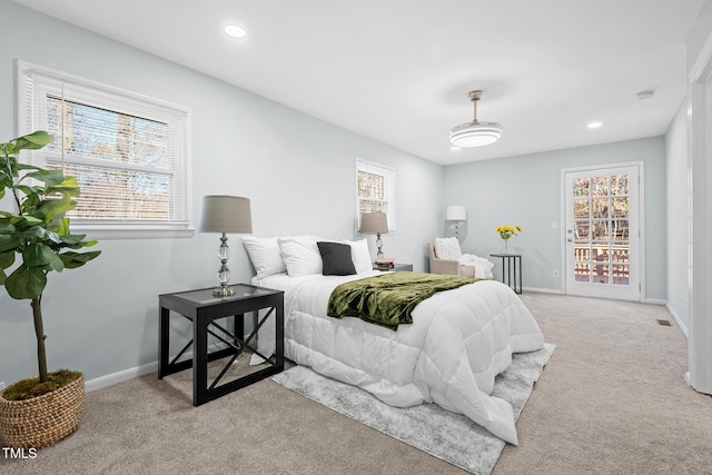 bedroom featuring light colored carpet