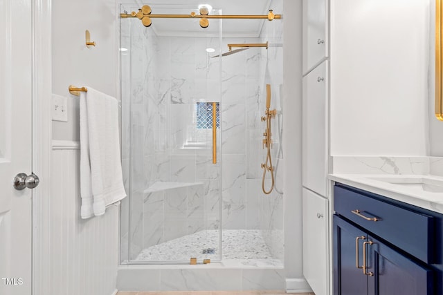 bathroom with vanity and a shower with door