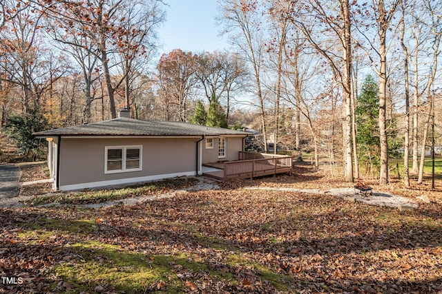 exterior space featuring a wooden deck