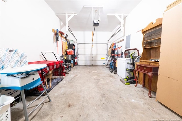 garage with electric panel and a garage door opener