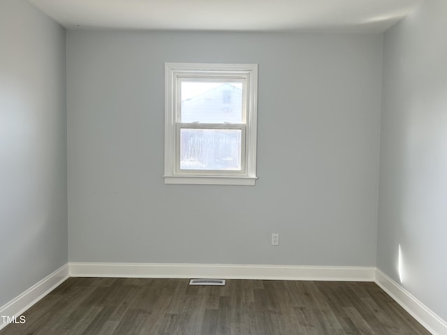 empty room featuring dark hardwood / wood-style floors