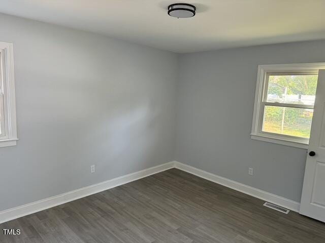 empty room featuring dark hardwood / wood-style floors