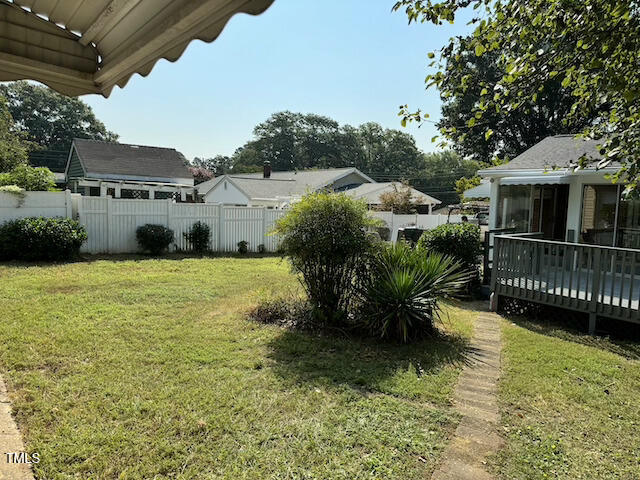 view of yard featuring a wooden deck