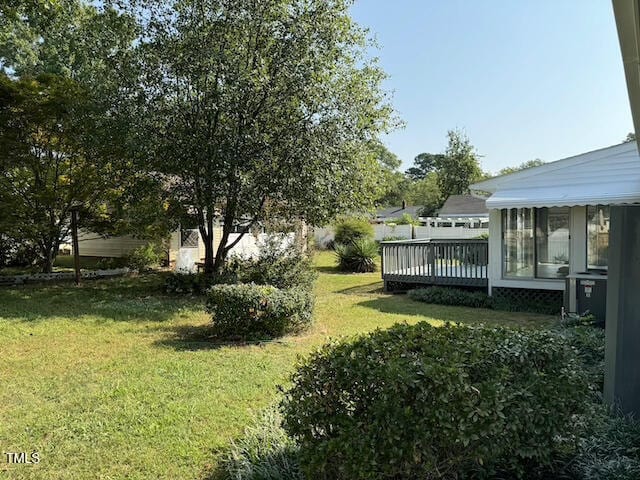 view of yard featuring a wooden deck