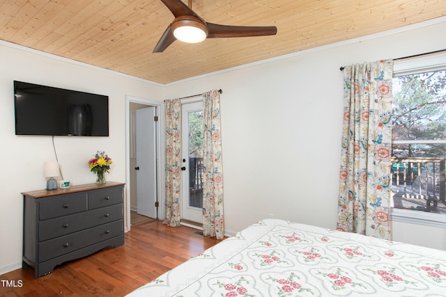 bedroom featuring dark wood-type flooring, ceiling fan, ornamental molding, and wood ceiling