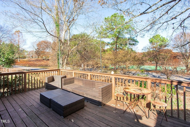 wooden deck featuring outdoor lounge area