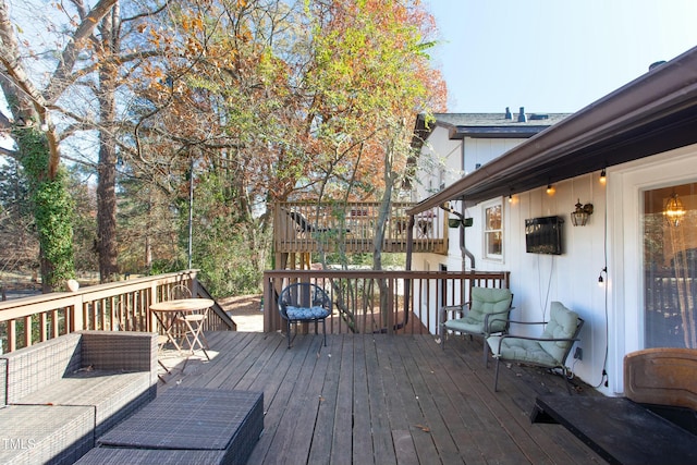 wooden deck featuring outdoor lounge area