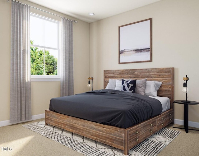 carpeted bedroom featuring baseboards