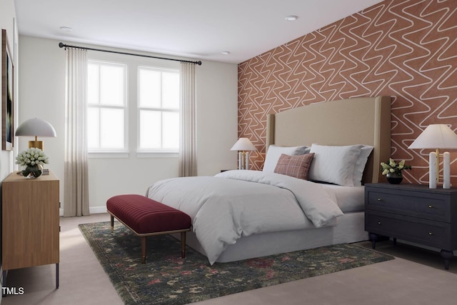 bedroom featuring carpet flooring, wallpapered walls, an accent wall, and baseboards