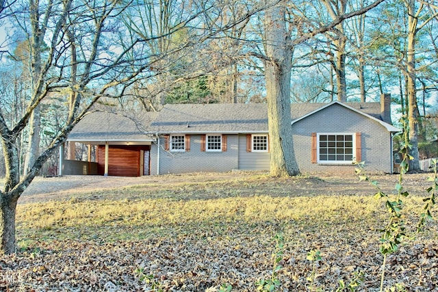 ranch-style house with a carport