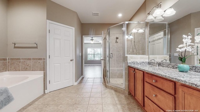 full bathroom featuring vanity, tile patterned flooring, visible vents, and a shower stall