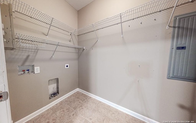 laundry room featuring laundry area, electric panel, baseboards, hookup for a washing machine, and hookup for an electric dryer