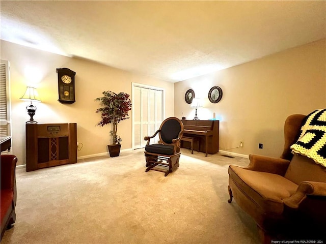 living area with light carpet