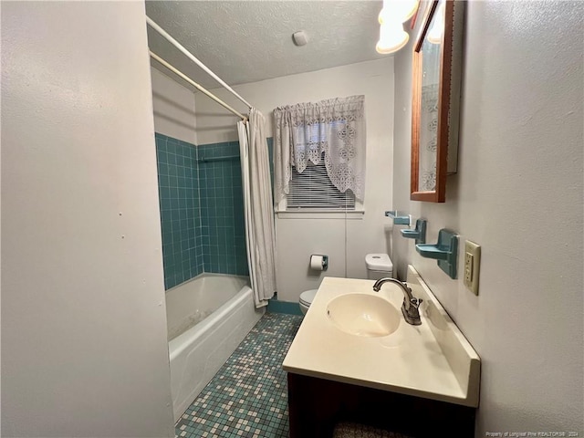 full bathroom featuring shower / bathtub combination with curtain, tile patterned flooring, a textured ceiling, toilet, and vanity