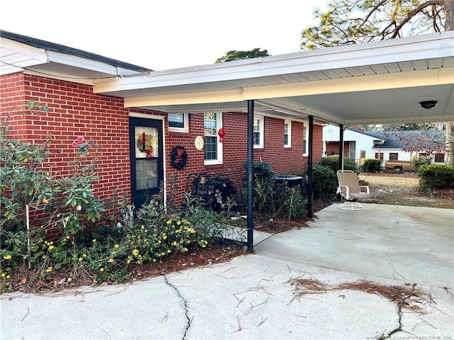 exterior space featuring a carport