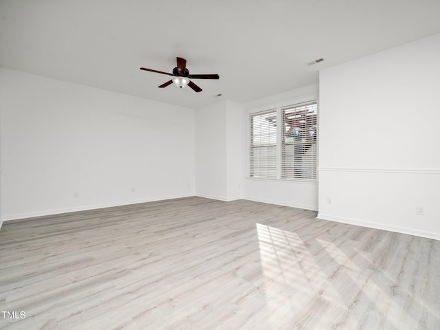 spare room with light hardwood / wood-style floors and ceiling fan