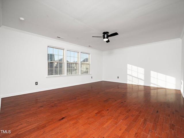 spare room featuring crown molding, ceiling fan, and hardwood / wood-style flooring