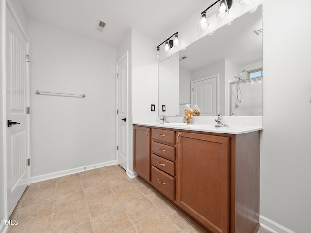 bathroom featuring vanity and a shower with shower door