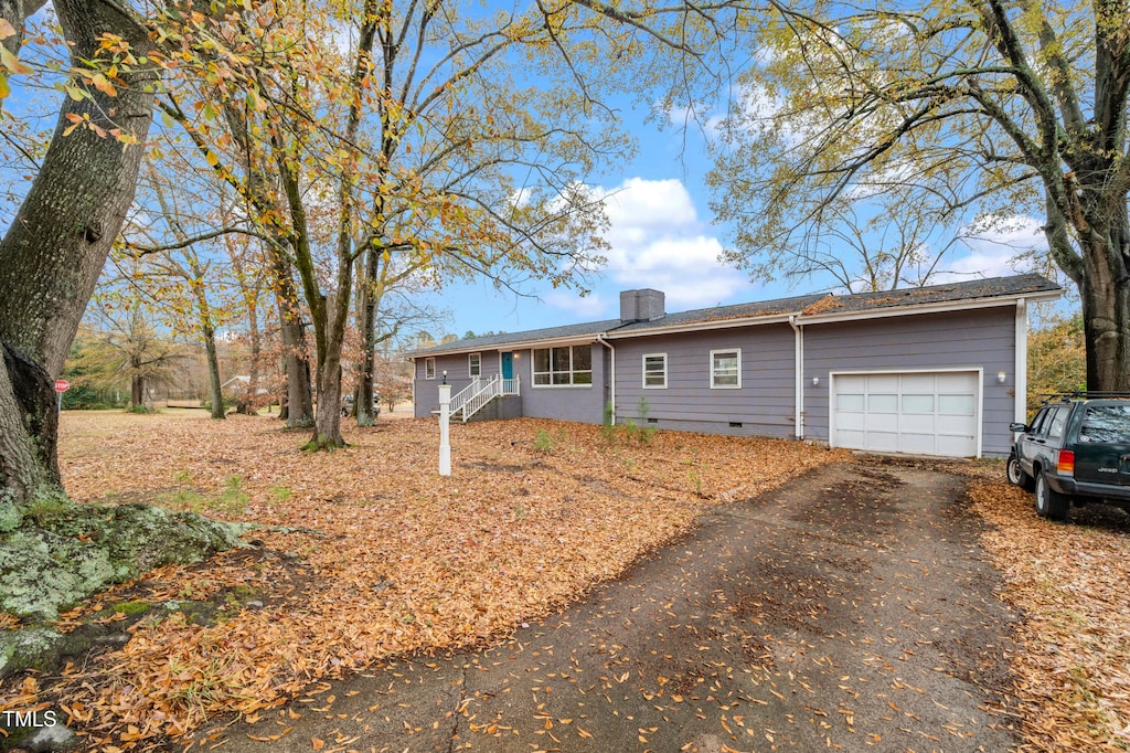 ranch-style home with a garage