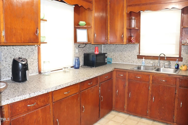 kitchen featuring decorative backsplash and sink