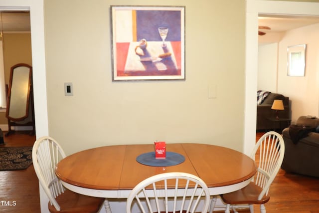 dining area with dark hardwood / wood-style floors