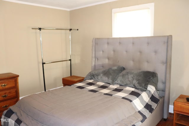 bedroom with ornamental molding