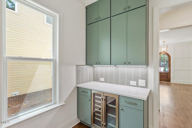 3302.5 Hall Pl, Raleigh, NC 27607 - bar with baseboards, decorative backsplash, beverage cooler, and wood finished floors