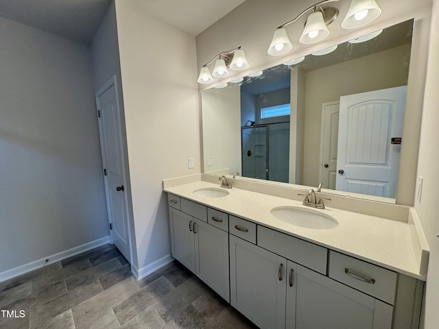 bathroom with vanity and an enclosed shower