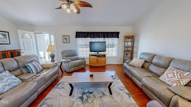 living room with hardwood / wood-style flooring and ceiling fan