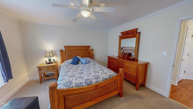 bedroom with ceiling fan, light hardwood / wood-style floors, and crown molding