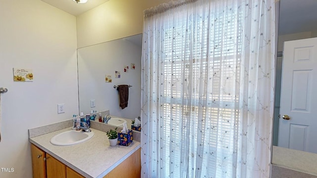 bathroom featuring vanity and a healthy amount of sunlight