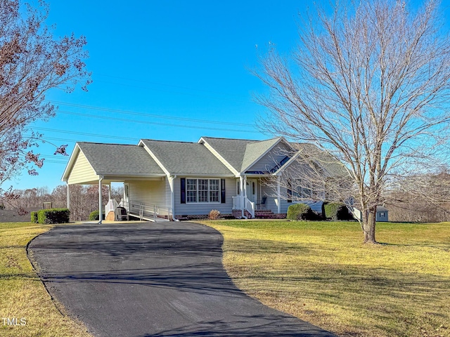 ranch-style home featuring a front yard and a carport