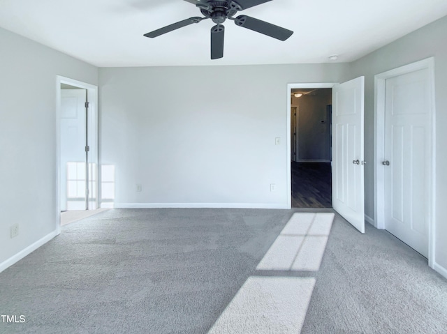 carpeted empty room with ceiling fan