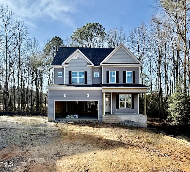 view of front facade featuring a garage and a porch