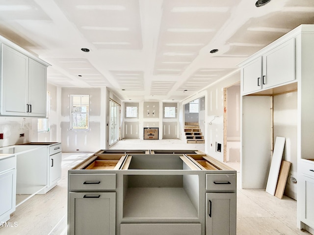 kitchen with a kitchen island and gray cabinets