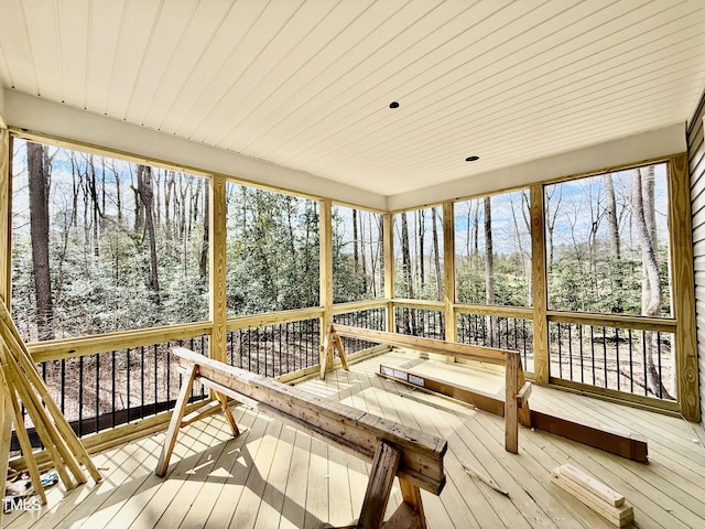 sunroom featuring wood ceiling