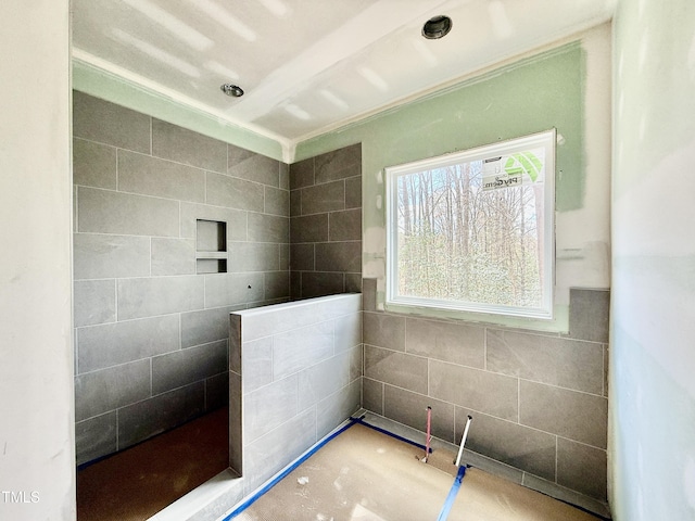 full bathroom with a tile shower