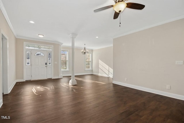 entryway featuring ceiling fan with notable chandelier, dark hardwood / wood-style floors, ornate columns, and crown molding