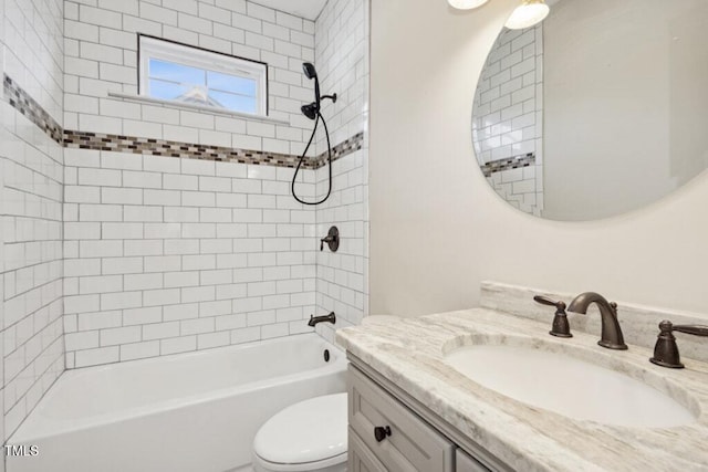 full bathroom with vanity, toilet, and tiled shower / bath combo