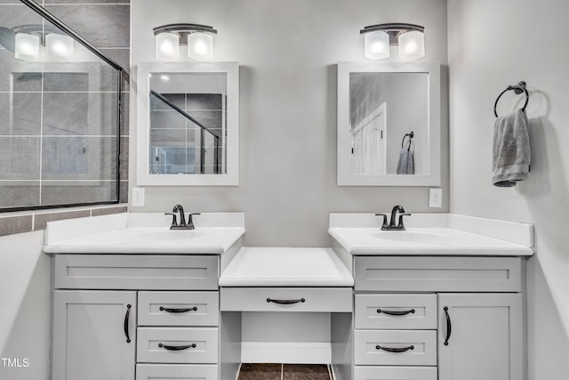 bathroom with tile patterned flooring, vanity, and an enclosed shower