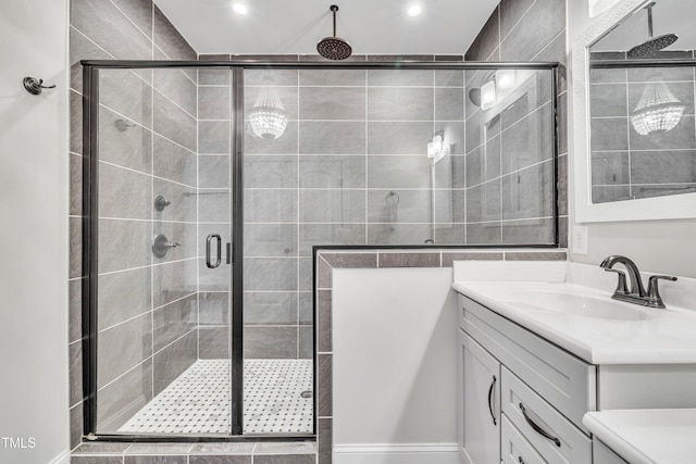 bathroom with vanity and an enclosed shower