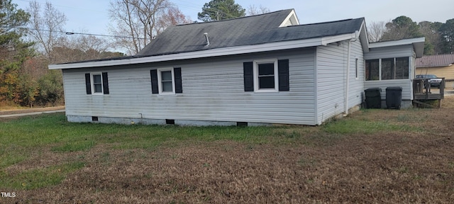 view of home's exterior featuring a yard