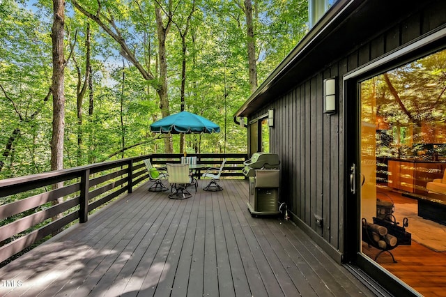 wooden terrace featuring grilling area