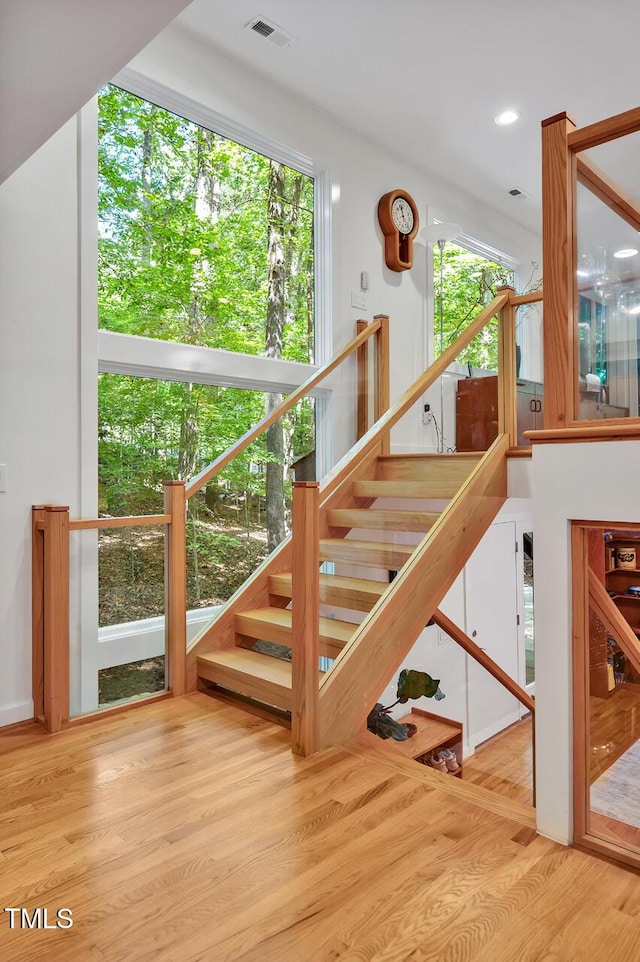 stairway featuring hardwood / wood-style floors