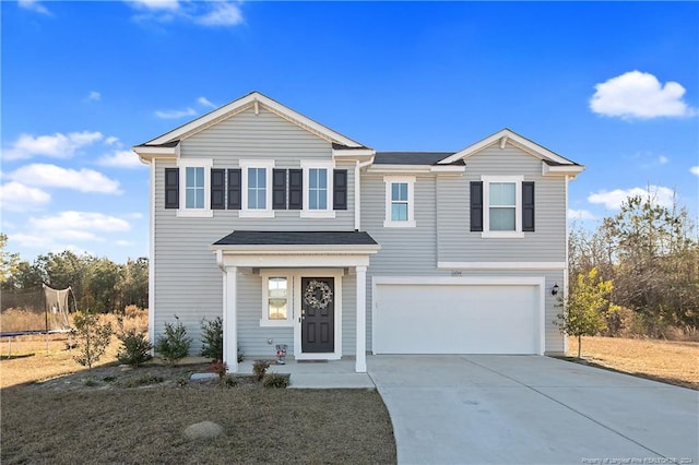 front of property with a garage