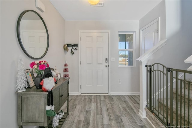 foyer entrance with light wood-type flooring